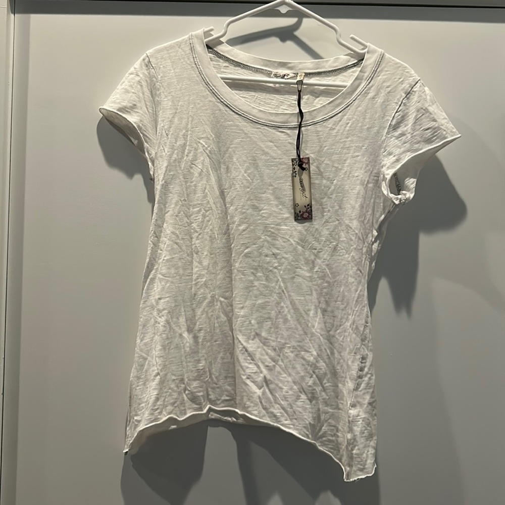 True Grit white tee with blue trip around neck. Size Medium